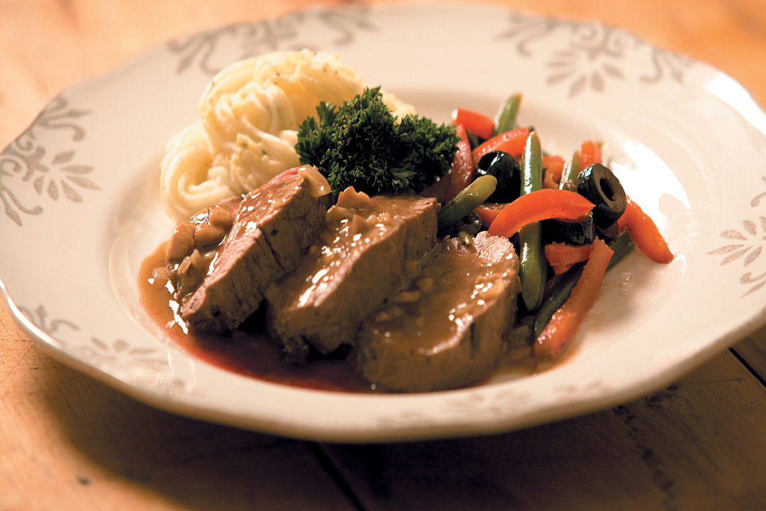 Fillet of beef with porcini mushroom gravy, mashed potatoes and stir-fried vegetables recipe