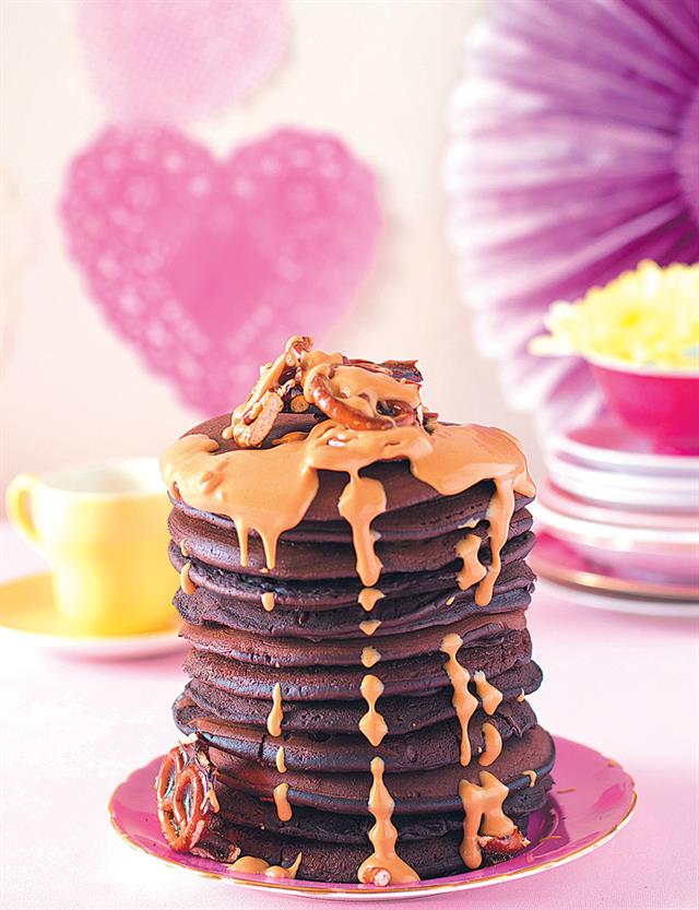 mile-high chocolate brownie flapjack stack with pretzel brittle and peanut butter sauce
