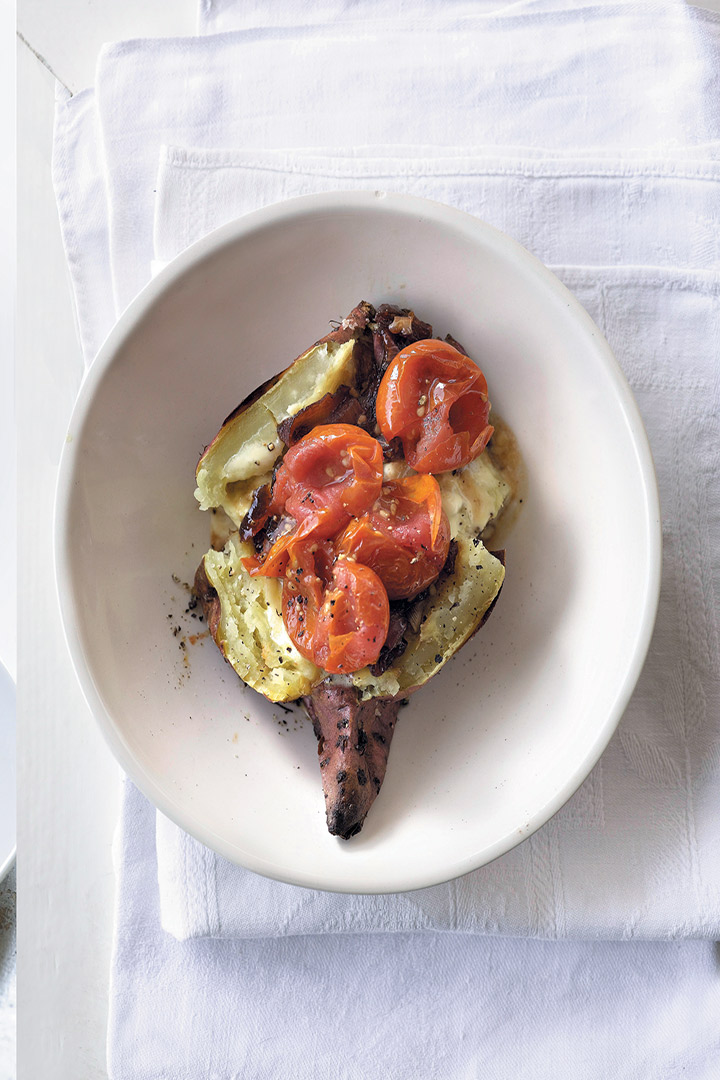 Baked sweet potato with caramelised red onion, Rosa tomatoes and creme fraiche recipe