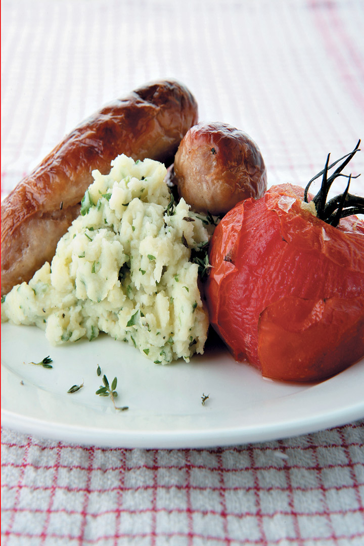 Bangers and herby mash with roasted vine tomatoes recipe