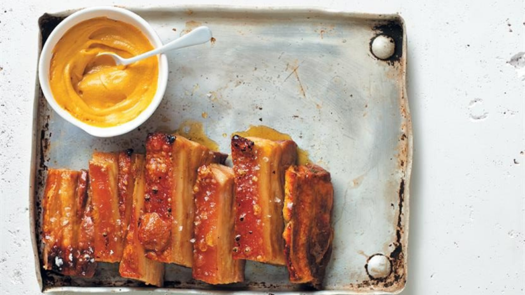 Sticky maple and ginger-glazed pork belly with crunchy crackling and hot English mustard