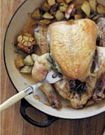 Roast chicken with whole heads of garlic