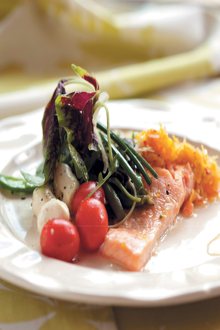 Poached salmon with citrus dressing and greens recipe