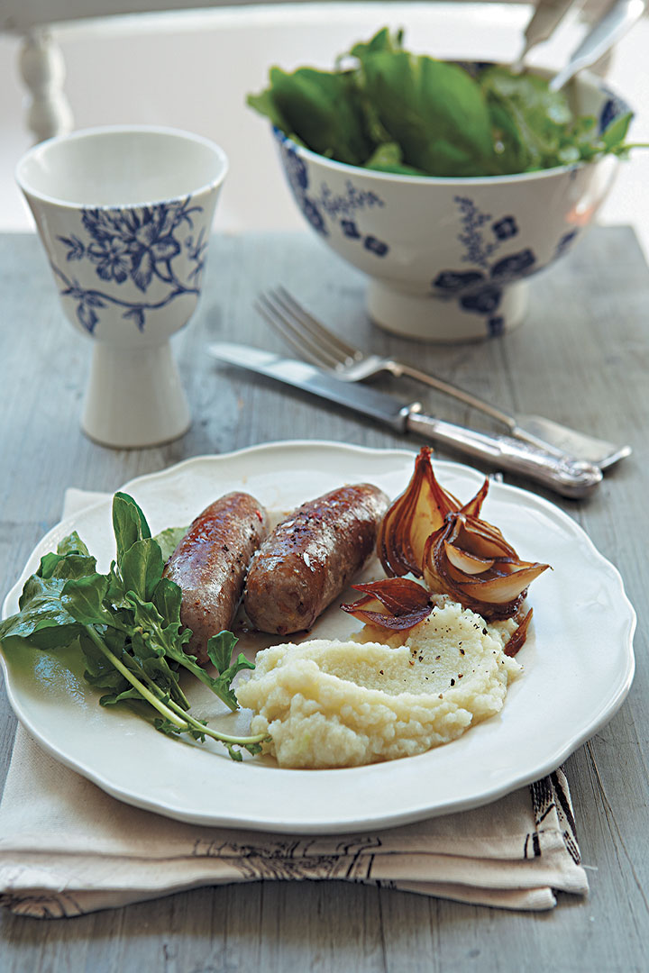 Cauliflower and garlic purée with lamb sausages and balsamic roasted onions recipe