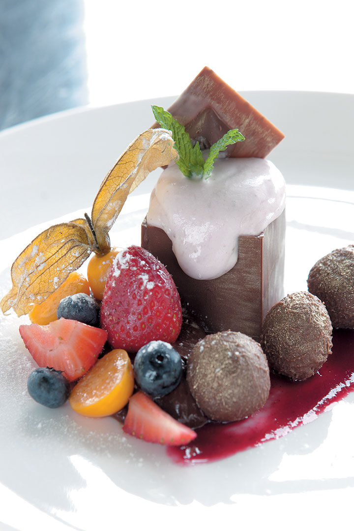 Chocolate box filled with strawberry mousse served with Cape fruits recipe