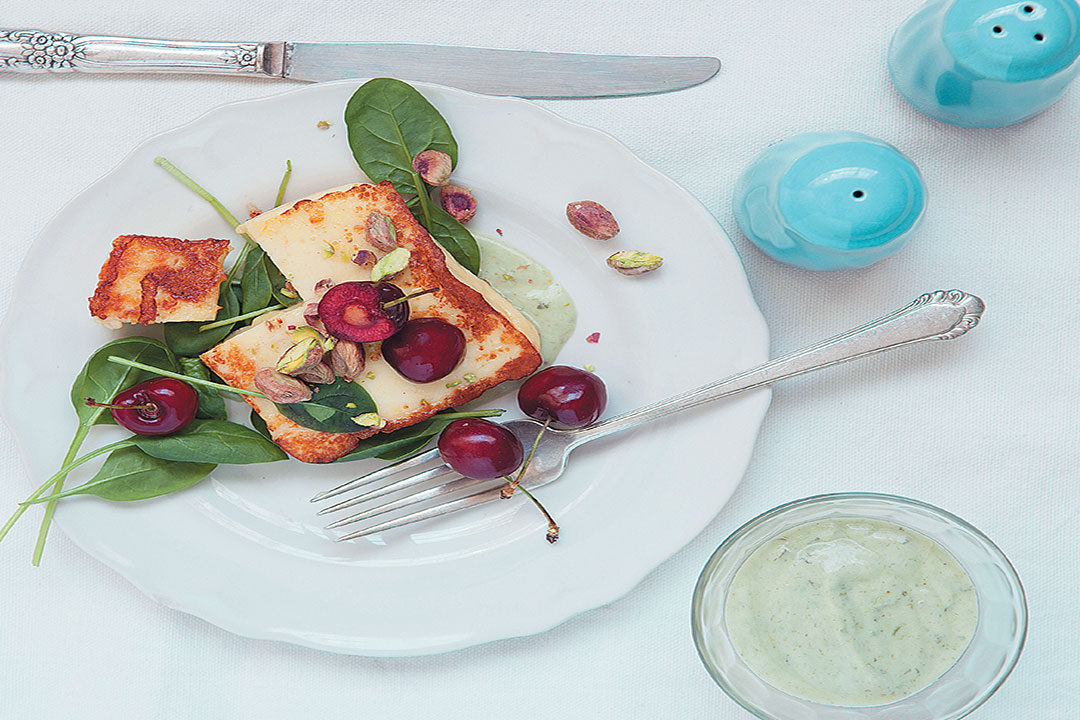 Haloumi, cherry and baby spinach salad with a creamy pesto dressing recipe
