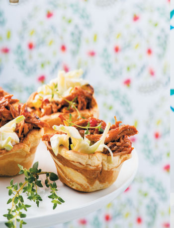 Mini savoury crème fraîche flapjack cups topped with pulled pork and apple slaw recipe