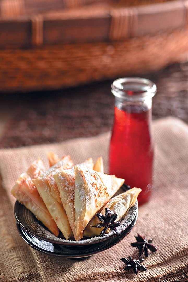 Nuts, spices and rose syrup triangles recipe