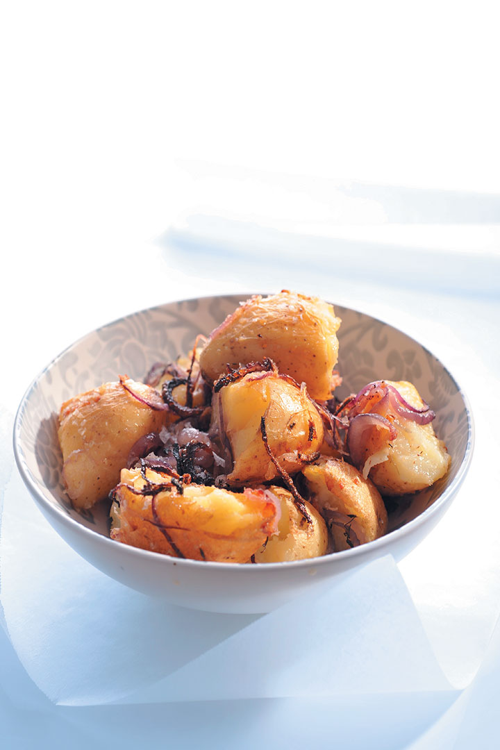 Smashed roast potatoes with red onions, herbs and ginger recipe