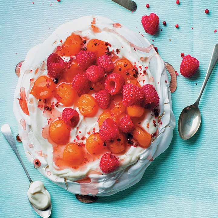 Pavlova with rosé-poached sweet melon, raspberries, pink peppercorns and vanilla yoghurt