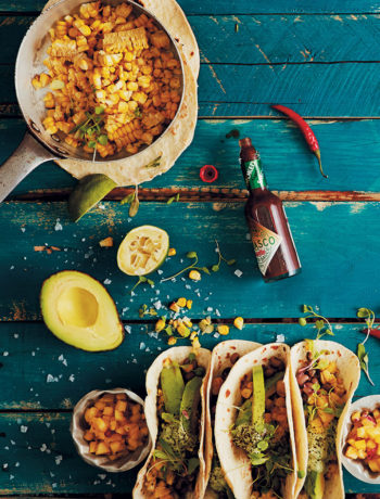 Flour soft-shell tacos with grilled corn, spiced black-eyed beans, cashew-nut cream and pineapple and chilli salsa