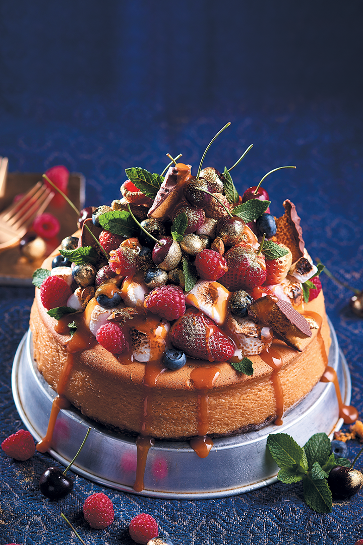 White chocolate and ginger baked cheesecake with caramel and golden berries