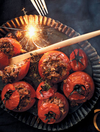 Whole roasted tomatoes stuffed with pecan nuts and goat’s cheese