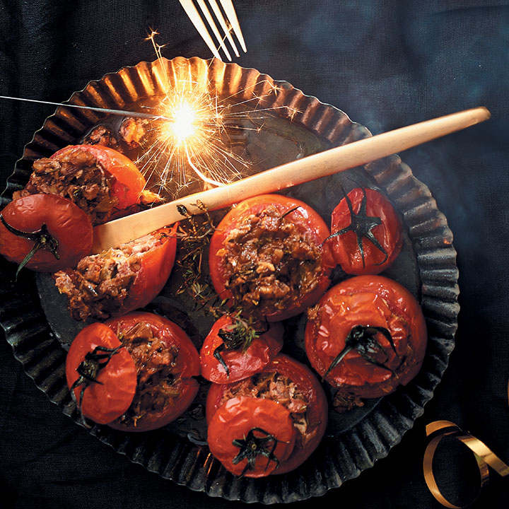 Whole roasted tomatoes stuffed with pecan nuts and goat’s cheese