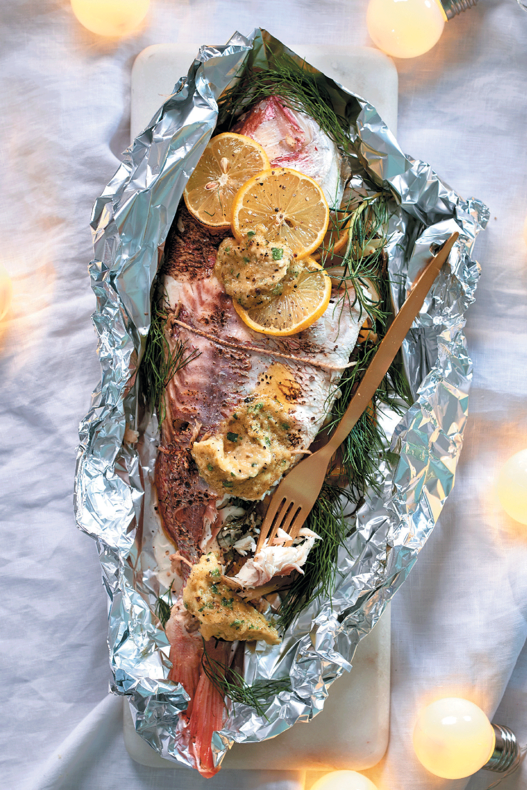 Braaied whole fish with fennel and caper butter