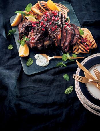 Spice-roasted lamb with mint pomegranate and lemon served with herbed yoghurt and flatbreads recipe