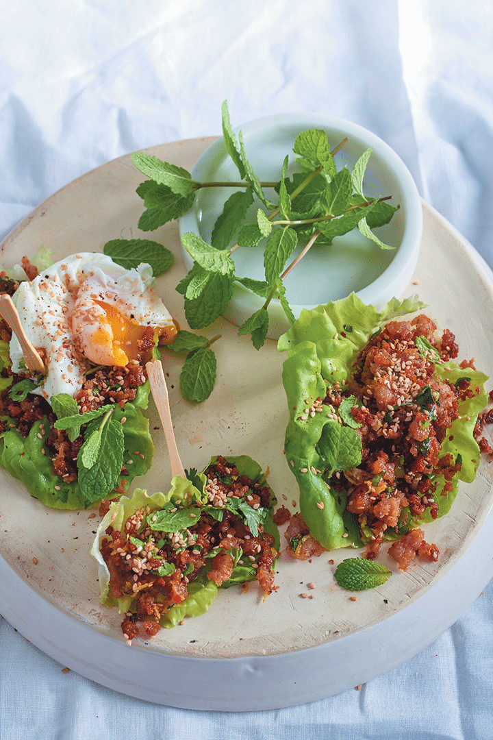Ginger and chilli pork in lettuce cups topped with a soft-yolk poached egg recipe