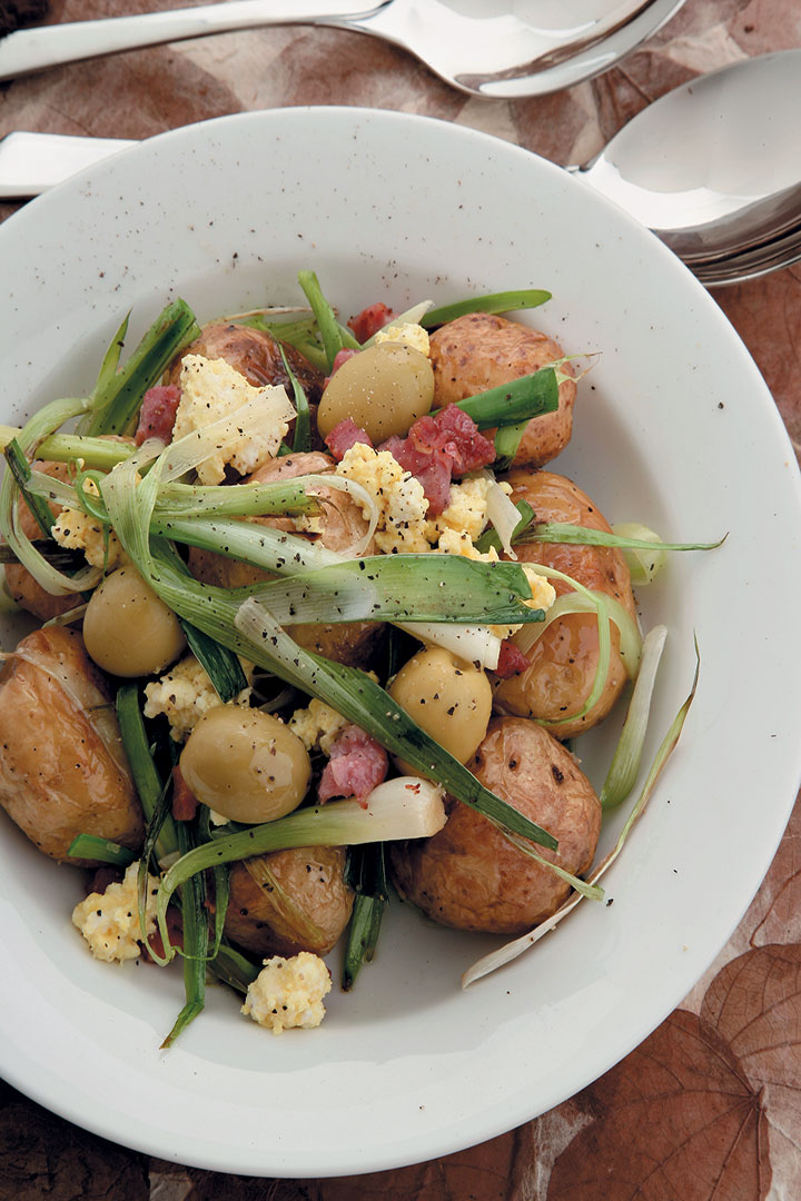 Roasted potatoes, crispy bacon and baby leek salad served with saffron ricotta and olives recipe