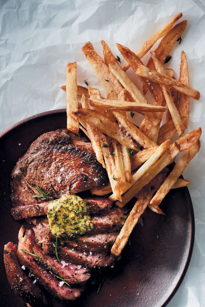 Pan-fried rib eye steak with herbed butter and skinny potato chips recipe