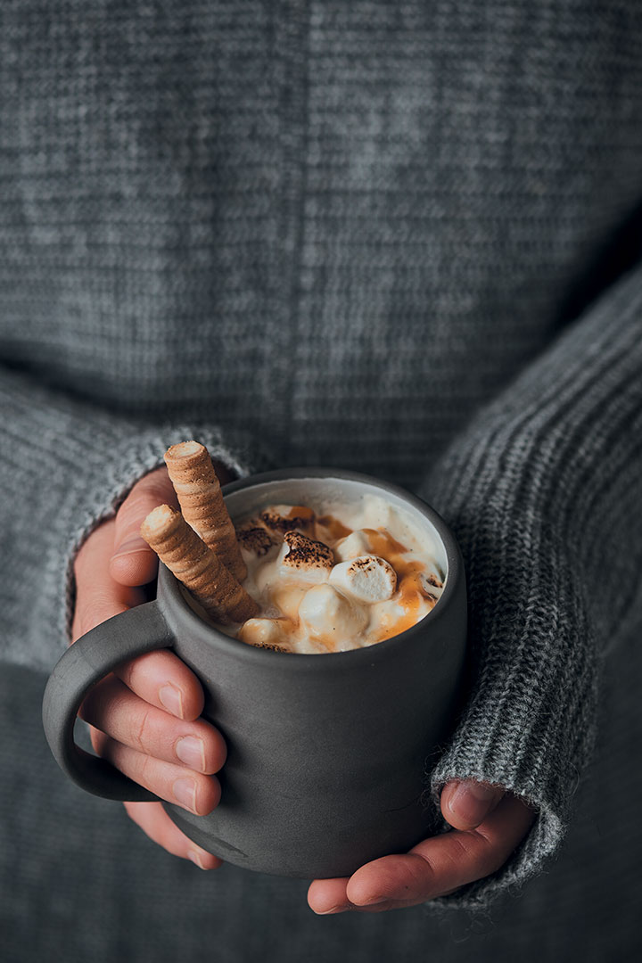 Home-made white hot chocolate with caramel and toasted marshmallows