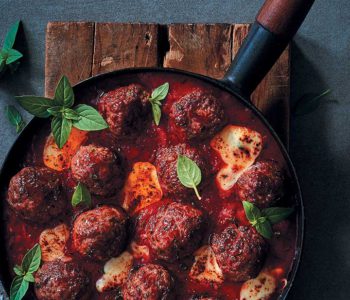 Herbed meatballs in tomato sauce with melty mozzarella