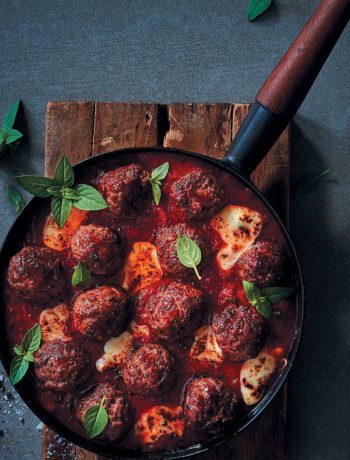 Herbed meatballs in tomato sauce with melty mozzarella