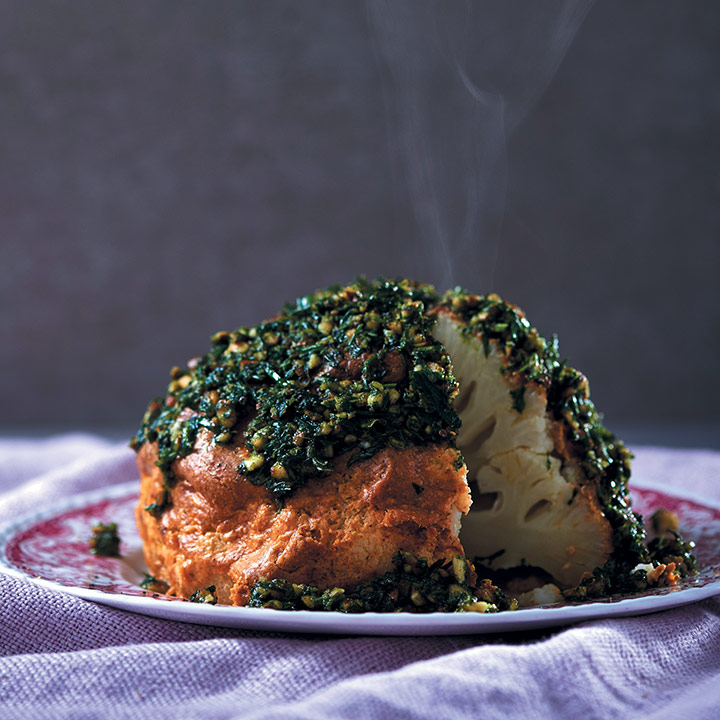 Whole spice and tahini roasted cauliflower with almond and herb pesto