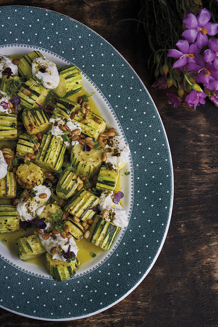 Roasted zucchini with labneh, za’atar and pine nuts