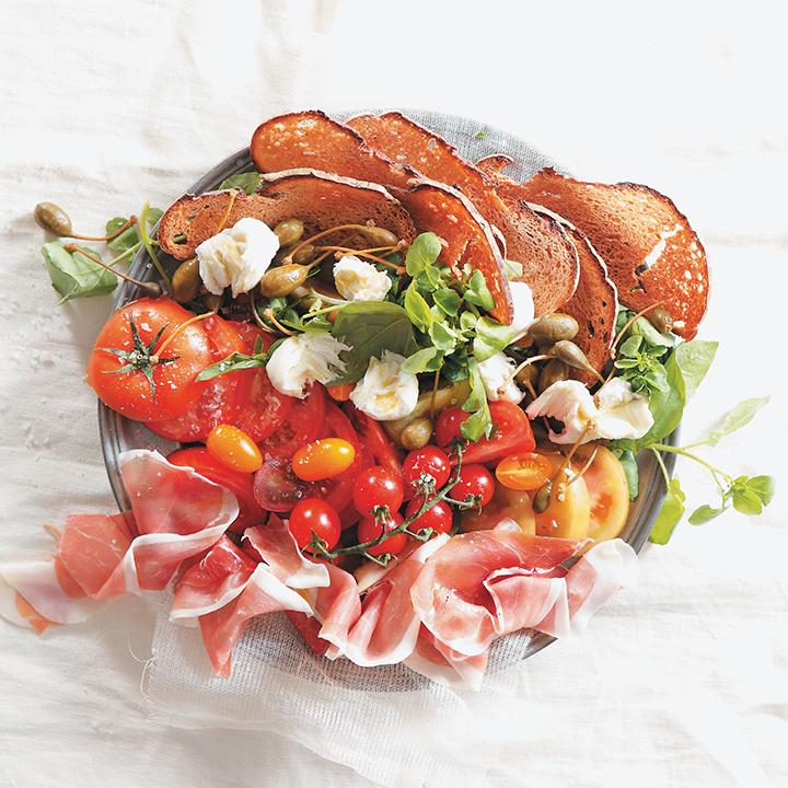 Parma ham and tomato salad with truffled pear dressing