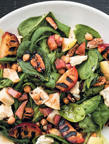 Spinach, chickpea, Gorgonzola and pecan nut salad with grilled plums