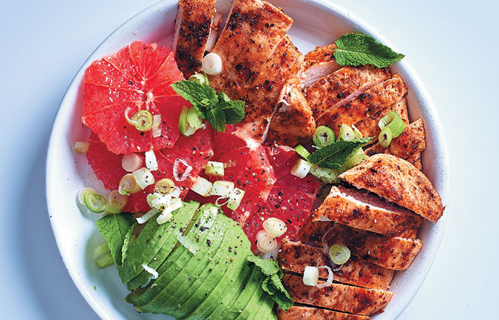Pan-fried chicken breasts with avo, grapefruit and spring onion salad