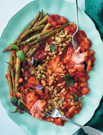 One-pan Mediterranean-style tomato and trout bake with asparagus and green olives