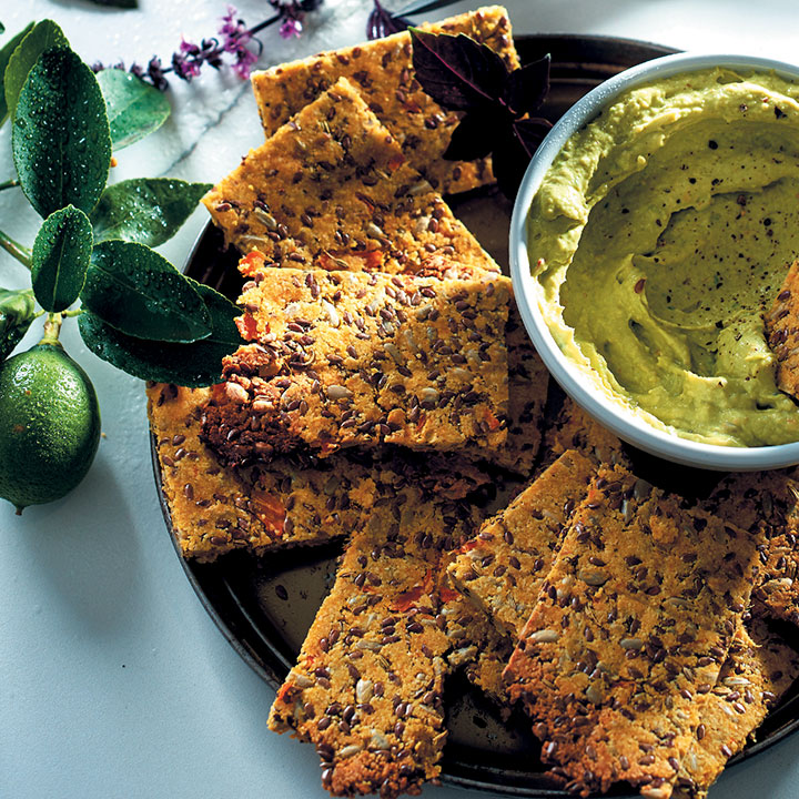 Carrot, almond and flax crackers with avo and tahini dip