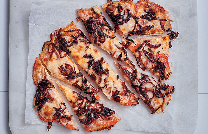 Caramelised onion and tomato naan pizza