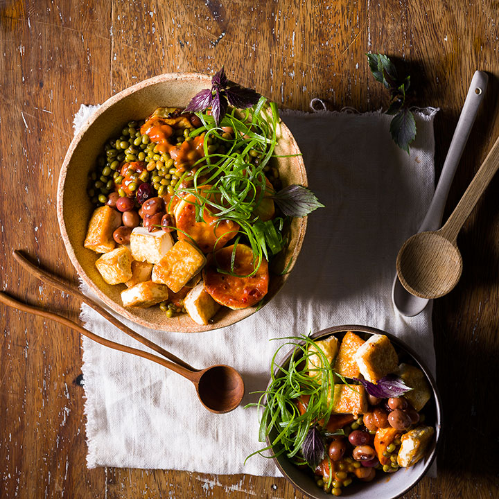 Crispy tofu with spring onions, mung beans and Bambara groundnuts tossed in peri-peri sauce