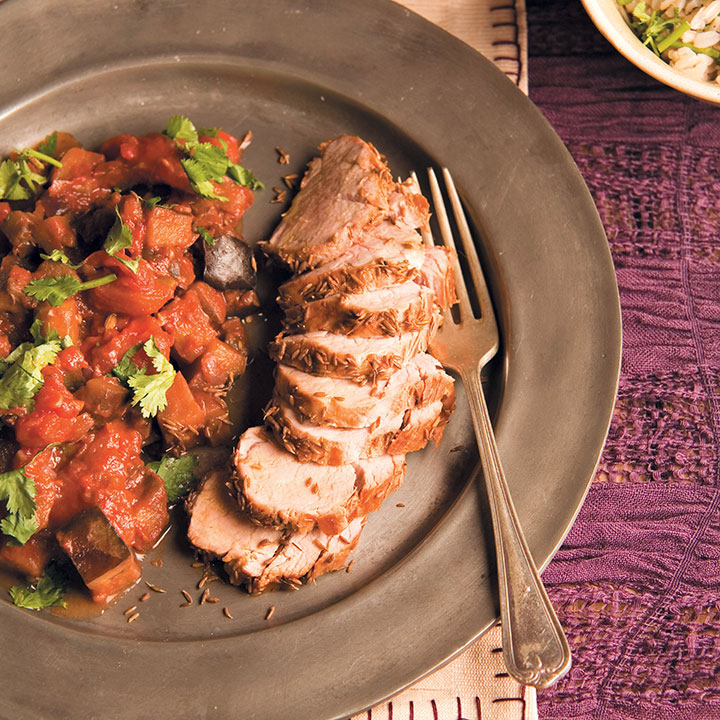 Cumin-crusted pork fillet with aubergine and tomato curry