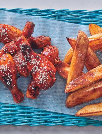 Sticky chicken drumsticks with roasted potato wedges