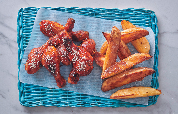 Sticky chicken drumsticks with roasted potato wedges