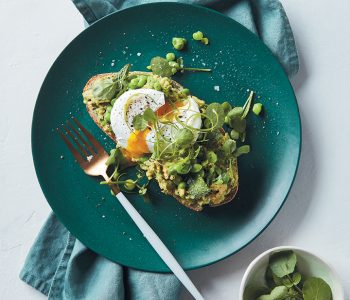 Smashed avocado and poached eggs on spinach soda bread