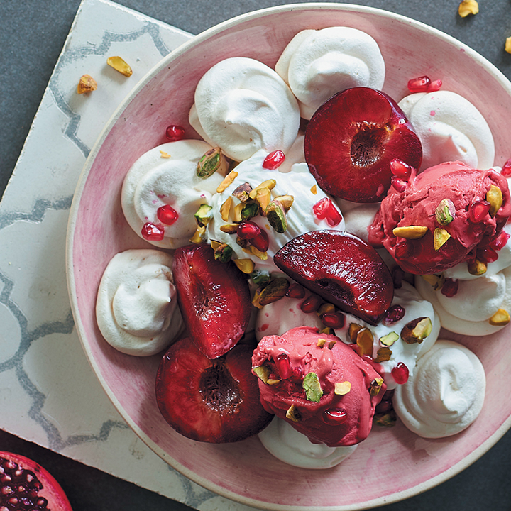 Vegan meringues with berry sorbet and plums