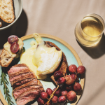 Grilled steak with roasted grapes