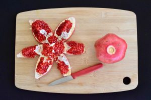 Cutting open a pomegranate