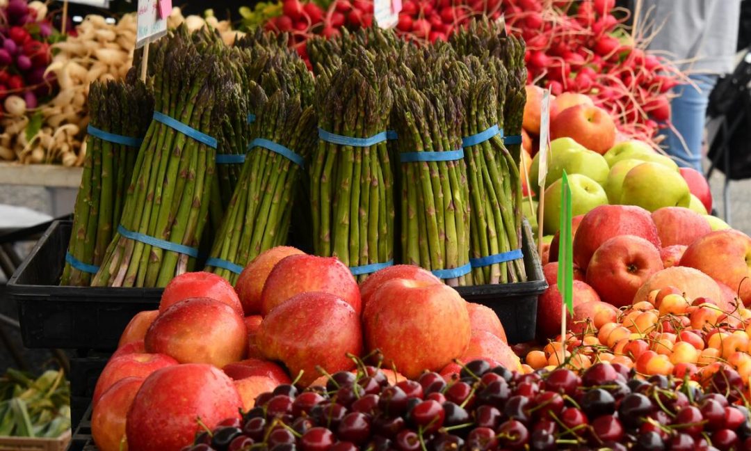 Spring produce including asparagus, cherries and other fruits and vegetables