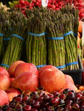 Spring produce including asparagus, cherries and other fruits and vegetables