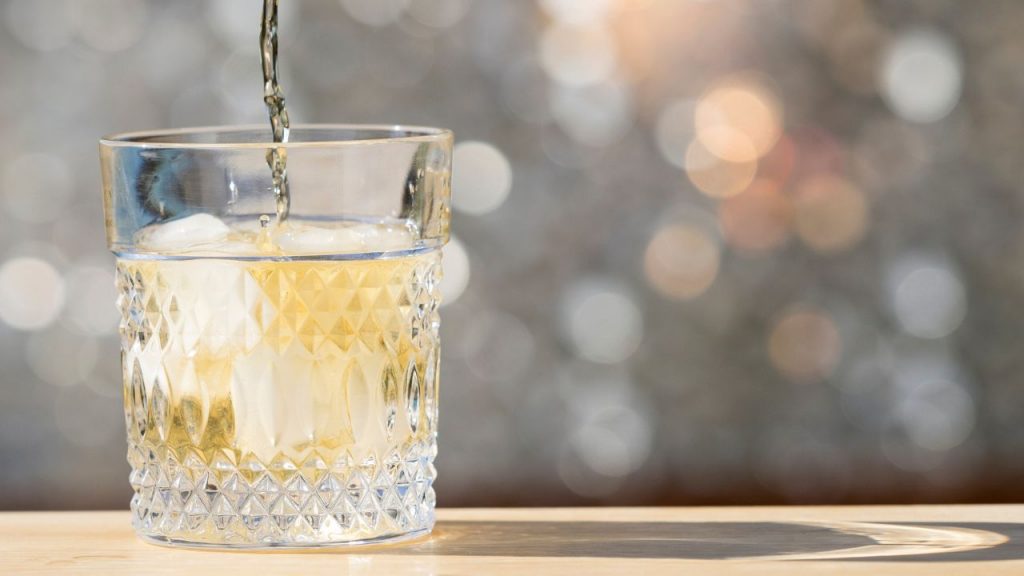 Pouring cocktail into a glass