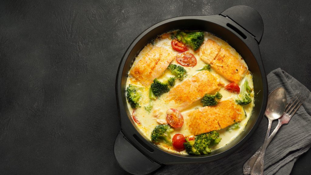 Butter-baked fish fillets with cherry tomatoes, capers and fresh herbs