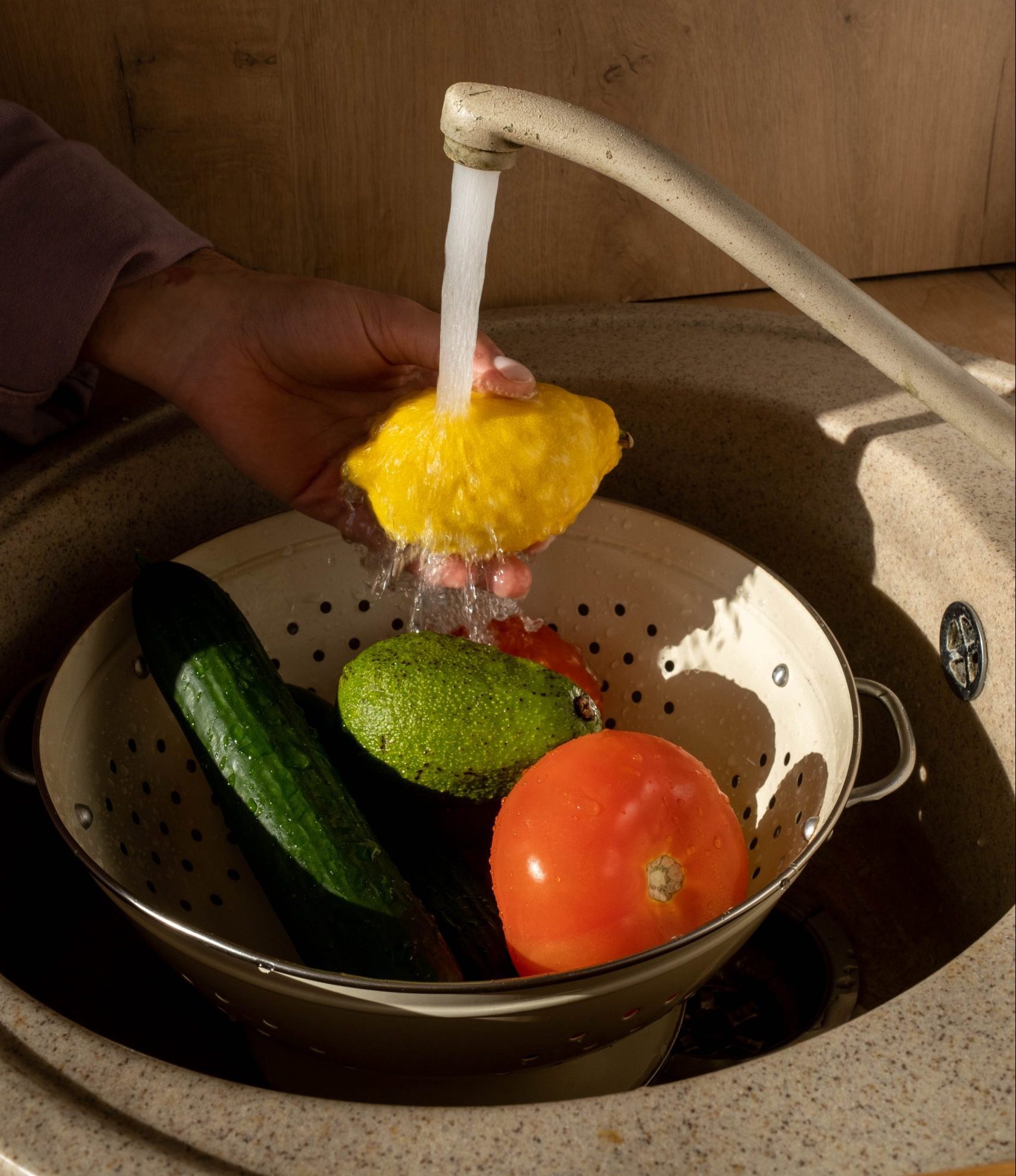 Fruits and vegetables being rinsed off
