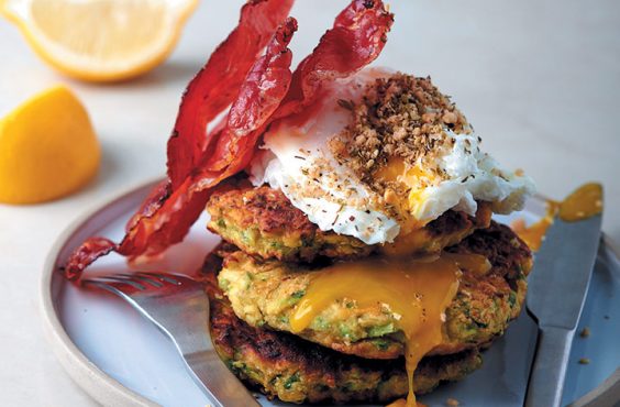 dukkha-sprinkled poached eggs with zucchini fritters and crispy prosciutto